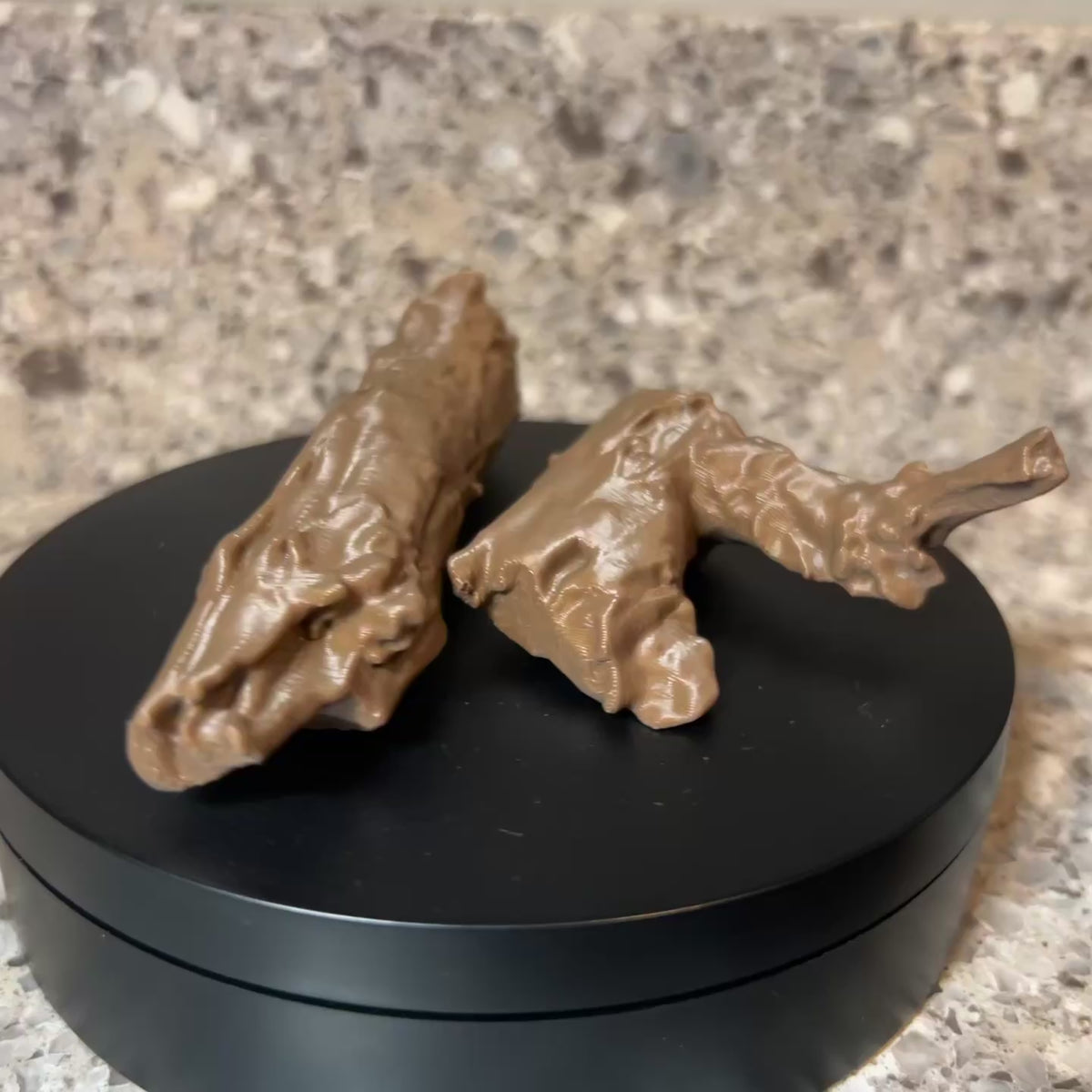 short video clip of stick shaped scent work hide rotating on a black turn table.  The hide is open showing where the cotton swab would be inserted. 